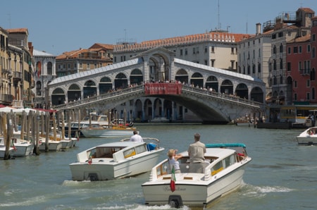 Water taxis on Grand Canal near Rialto Bridge, Venice
